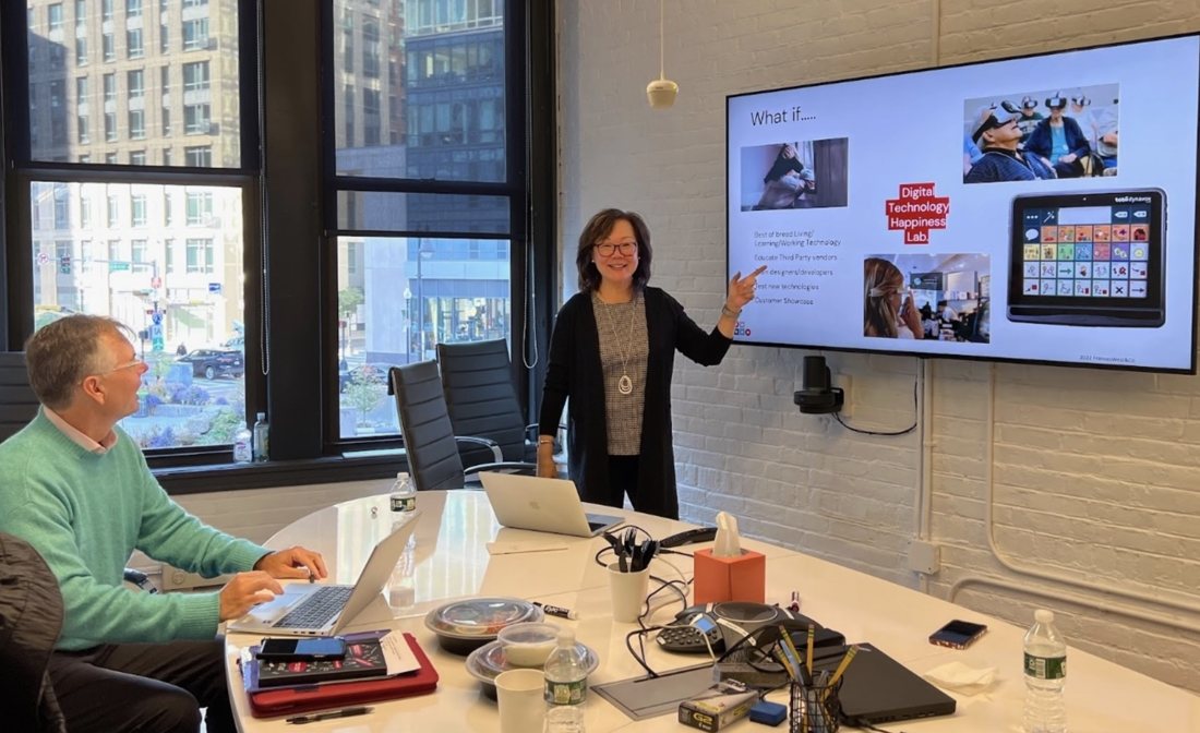 Frances West leading an executive briefing in a boardroom